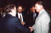 A nice picture of attendees conversing. Among those pictured are Everett Alvarez and Deputy Sec. Herschel Gober.